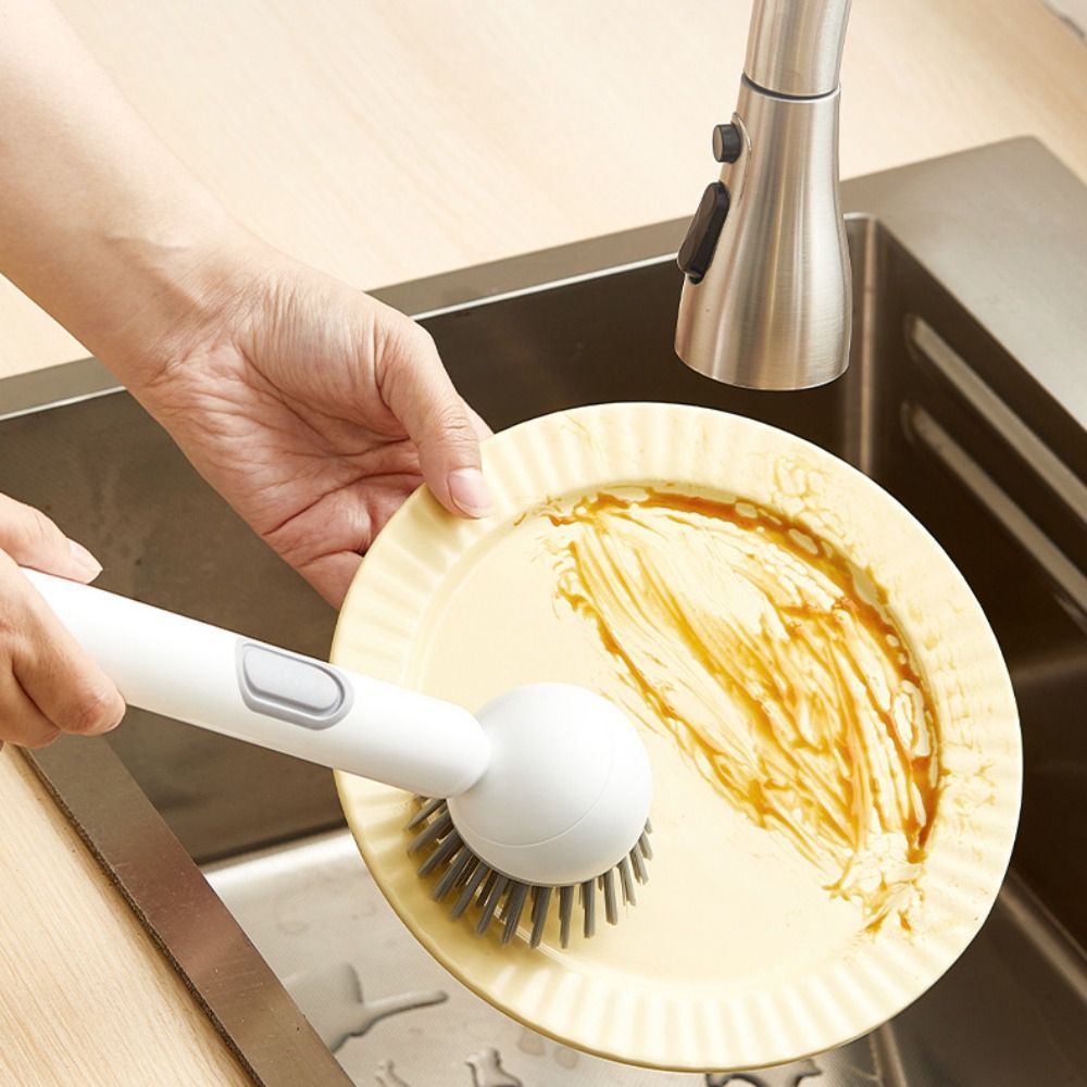 Liquid-Dispensing Dish Brush with Rotating Scrubber Head