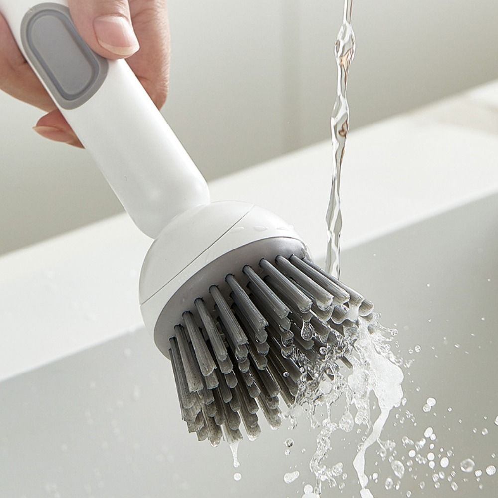 Liquid-Dispensing Dish Brush with Rotating Scrubber Head